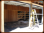 Barn remodel - garage doors installed. Inner wall knocked out