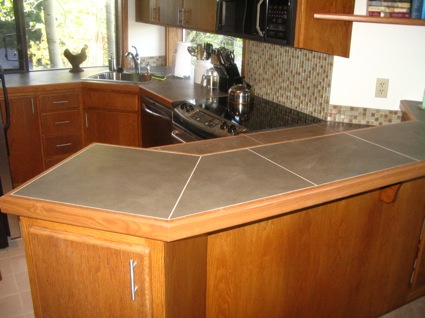 Kitchen remodel after new tile countertop installation.